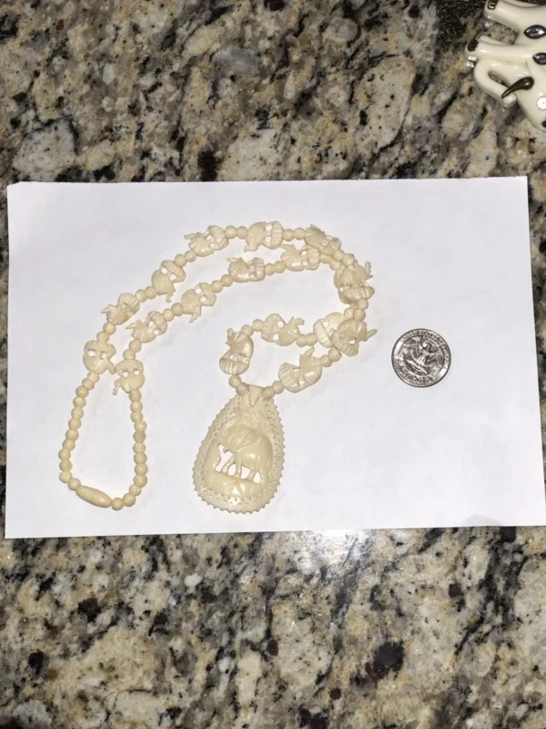 carved necklace