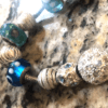 pandora bracelet with blue and silver beads close up