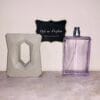 God is a Woman eau de parfum God is a Woman eau de parfum, displayed out of gray holder