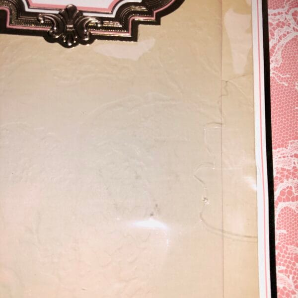 closeup of tear in cellophane of box