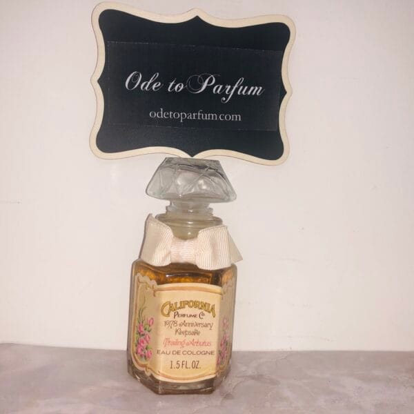 trailing arbutus 1978 california perfume co full bottle of eau de cologne with pink bow