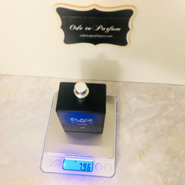 black one black for men eau de toilette spray on scale