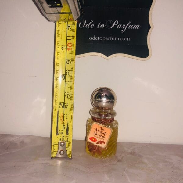 My Melody Moschus Musk Perfume EDT next to steel tape measure