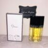 Oscar by Oscar de la Renta perfume, next to box, in front of Ode to Parfum sign