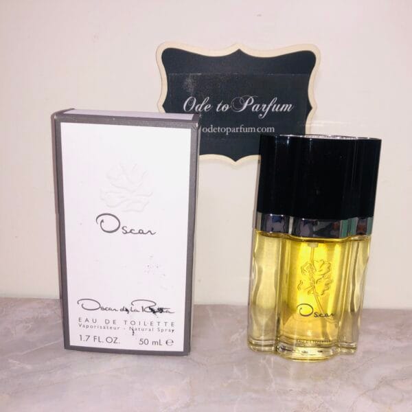 Oscar by Oscar de la Renta perfume, next to box, in front of Ode to Parfum sign