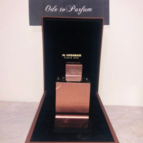 amber oud tobacco edition eau de parfum standing in velvet-lined box, with copper side showing