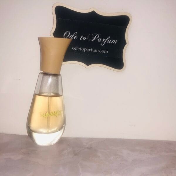Maurices Sungari perfume, original formula, 1 oz bottle next to Ode to Parfum sign