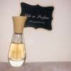 Maurices Sungari perfume, original formula, 1 oz bottle next to Ode to Parfum sign