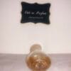 Maurices Sungari perfume, original formula, 1 oz bottle next to Ode to Parfum sign, bottom of bottle