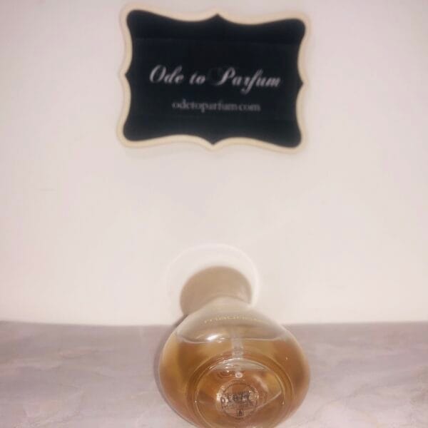Maurices Sungari perfume, original formula, 1 oz bottle next to Ode to Parfum sign, bottom of bottle