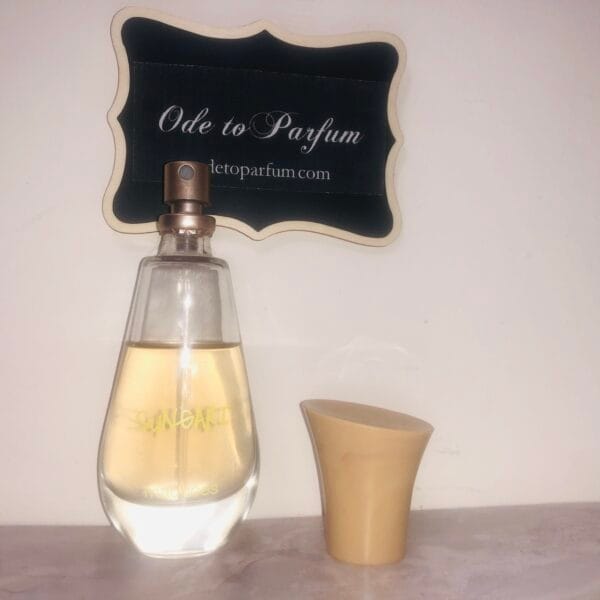 Maurices Sungari perfume, original formula, 1 oz bottle next to Ode to Parfum sign