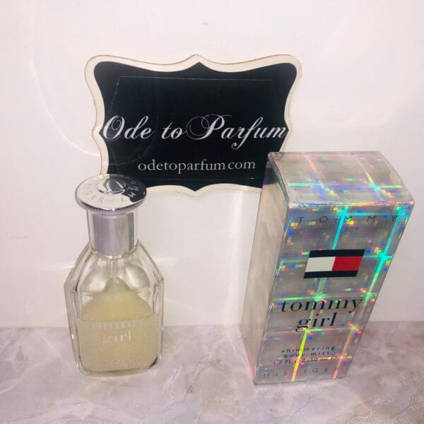 tommy girl shimmering body mist by tommy hilfiger, next to holographic box