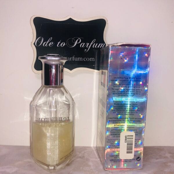 tommy girl shimmering body mist by tommy hilfiger, next to holographic box