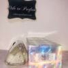 tommy girl shimmering body mist by tommy hilfiger, next to holographic box