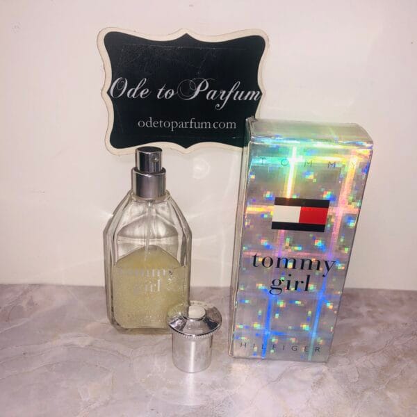 tommy girl shimmering body mist by tommy hilfiger, next to holographic box