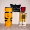Lattafa Yara Tous & Ana Abiyedh Rouge perfumes in front of Ode to Parfum sign