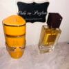 Lattafa Yara Tous & Ana Abiyedh Rouge perfumes in front of Ode to Parfum sign