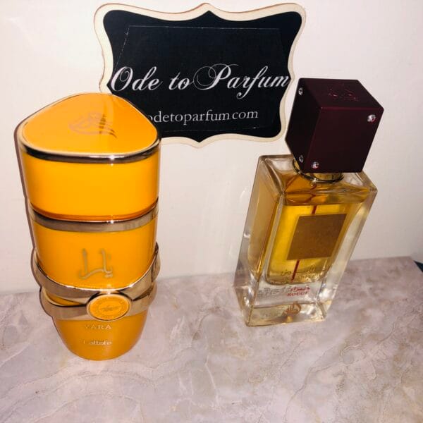 Lattafa Yara Tous & Ana Abiyedh Rouge perfumes in front of Ode to Parfum sign