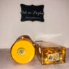 Lattafa Yara Tous & Ana Abiyedh Rouge perfumes in front of Ode to Parfum sign